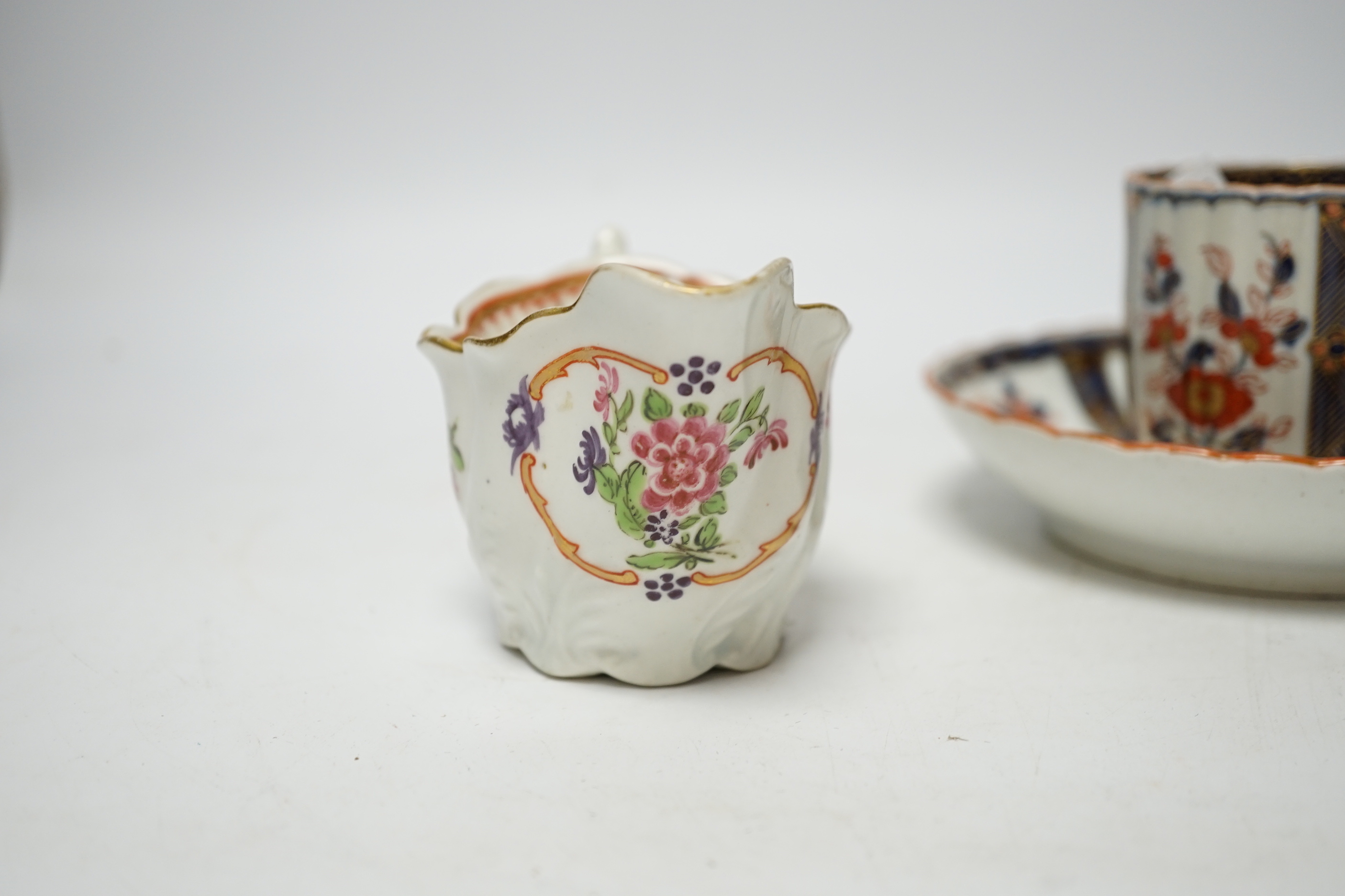 A Worcester ‘low Chelsea ewer’ milk jug, c.1770 and a Worcester Japan pattern coffee cup and saucer, c.1780, jug 6.5cm